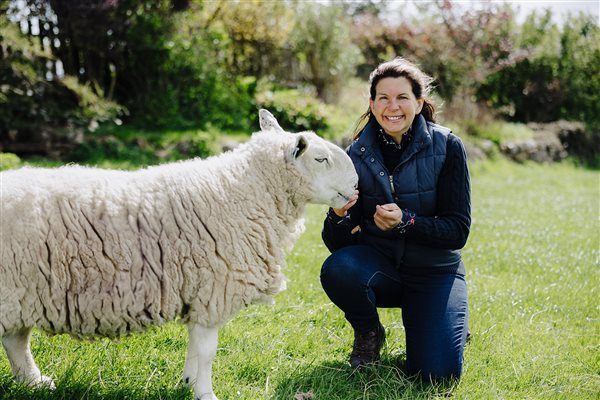 Liz - the owner of Cowden Farmhouse with one of the pet sheep